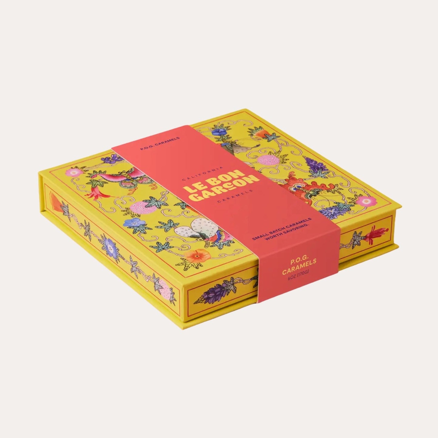 Colorful box with floral design and text on a white background