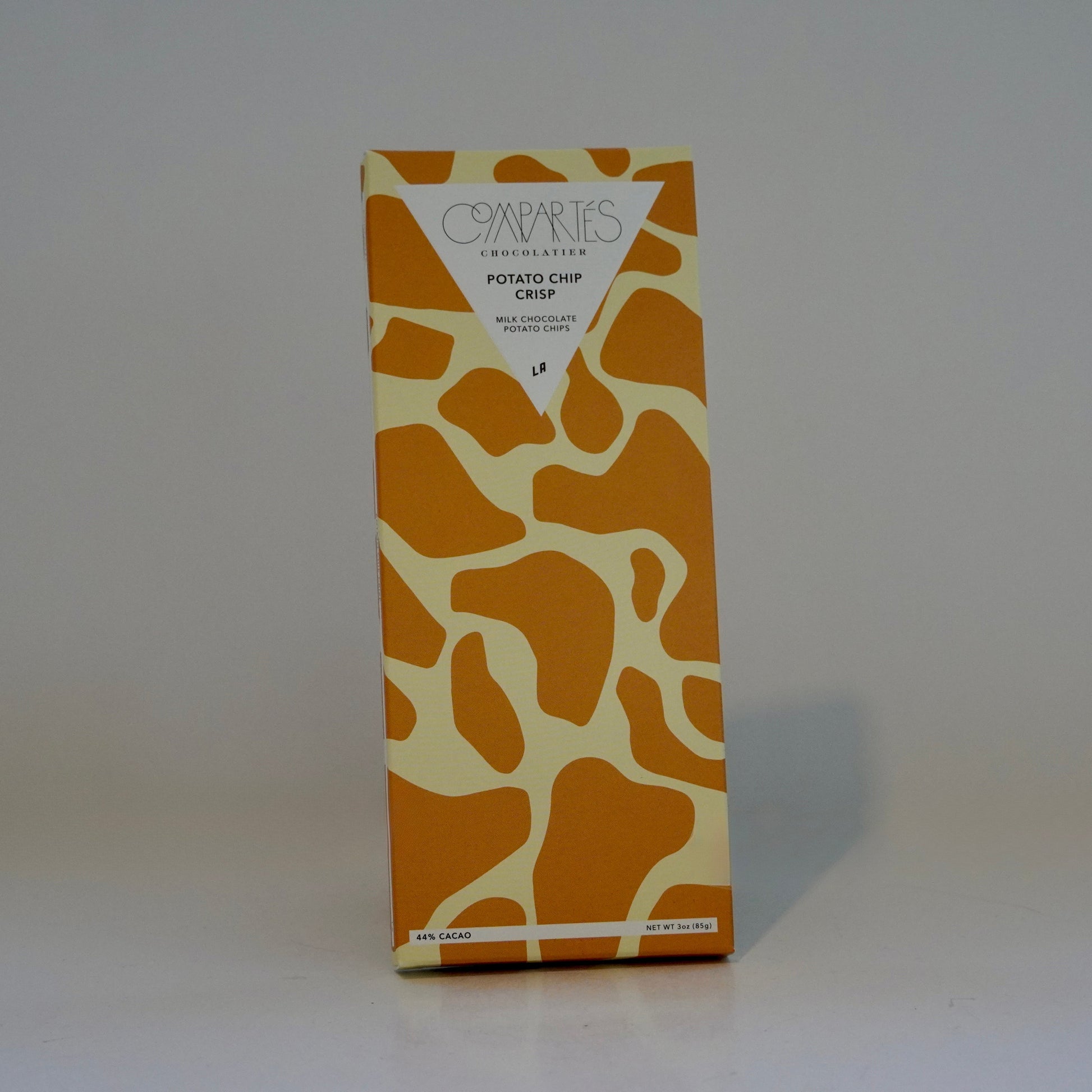 Compartes product packaging with a giraffe pattern on a white background