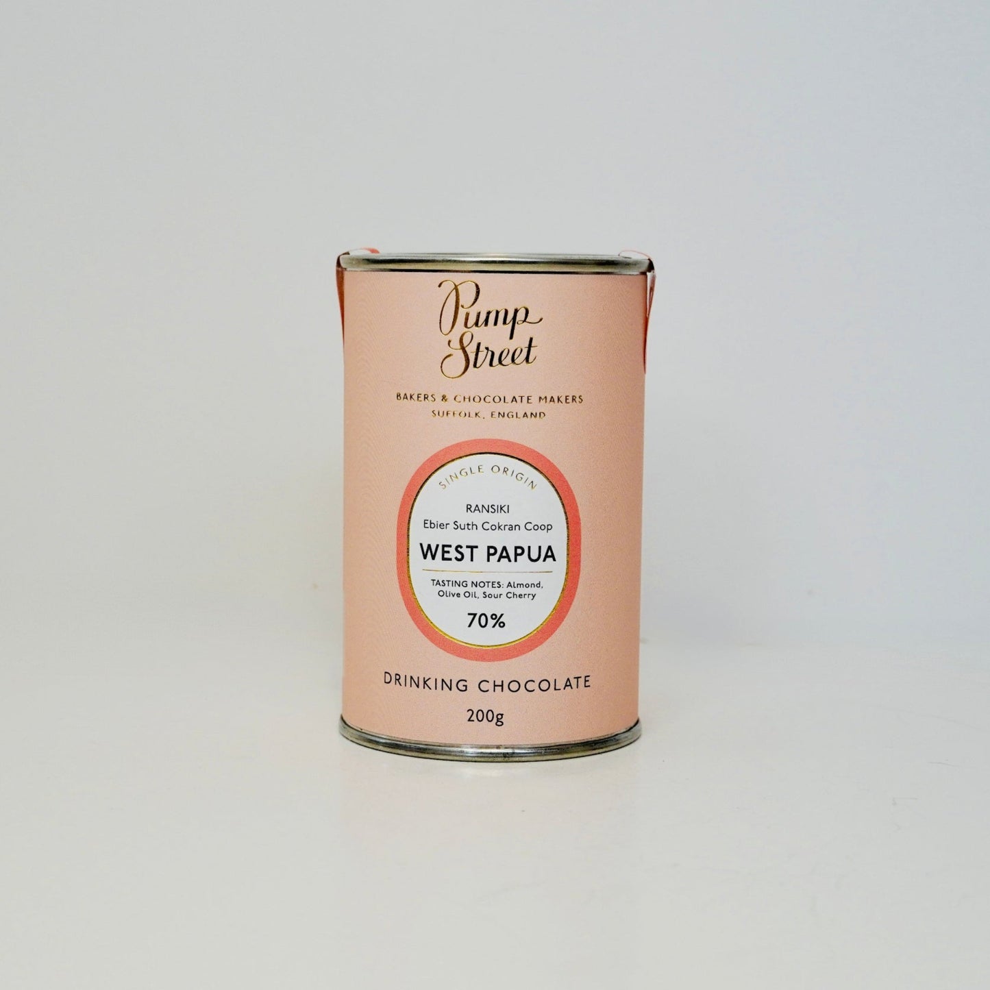 Can of drinking chocolate from West Papua with a visible brand label on a white background