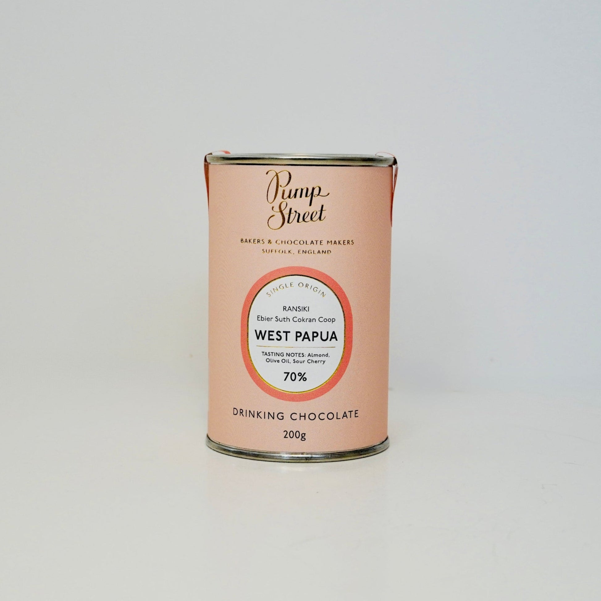 Can of drinking chocolate from West Papua with a visible brand label on a white background