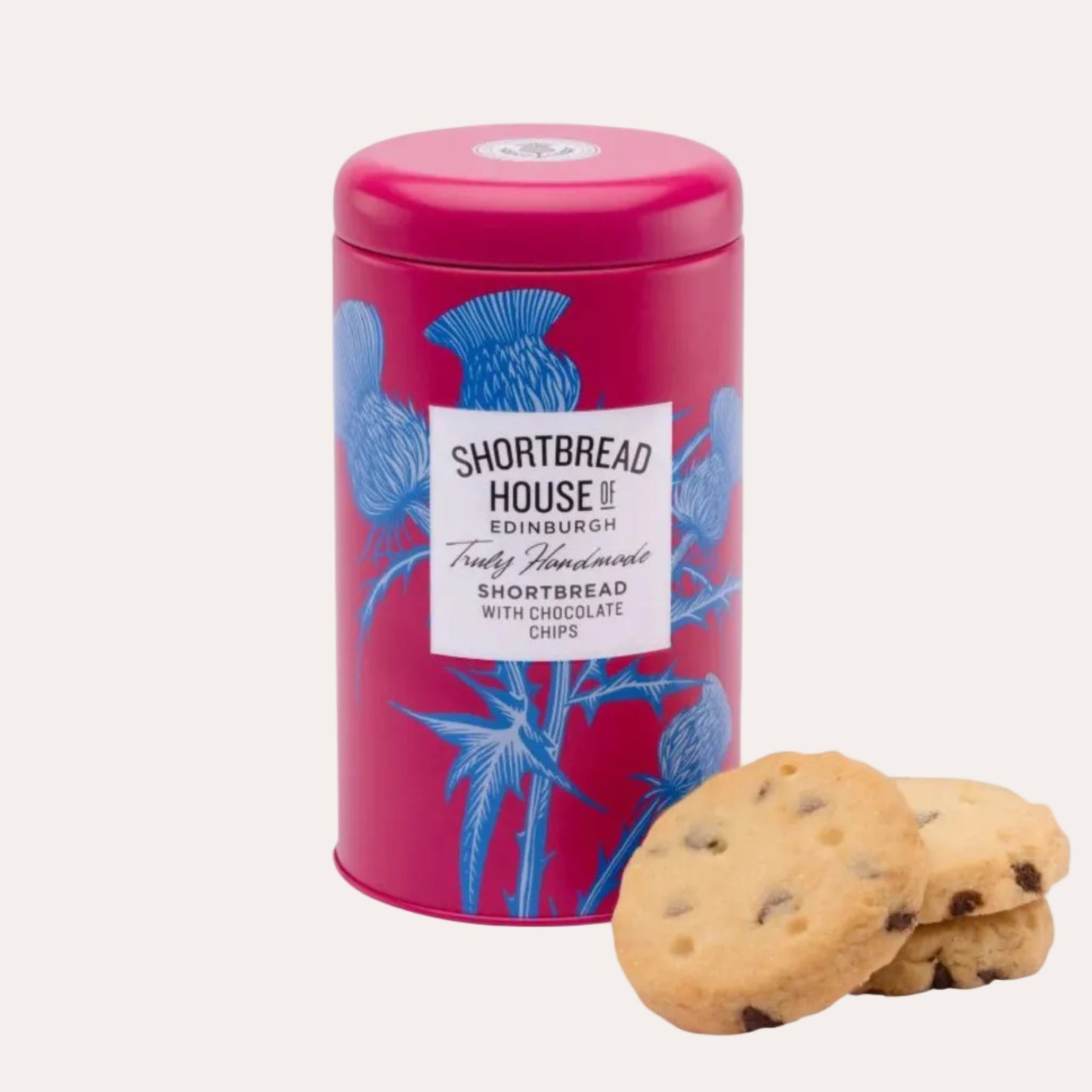 Pink tin of Shortbread House of Edinburgh shortbread cookies with chocolate chips on a white background