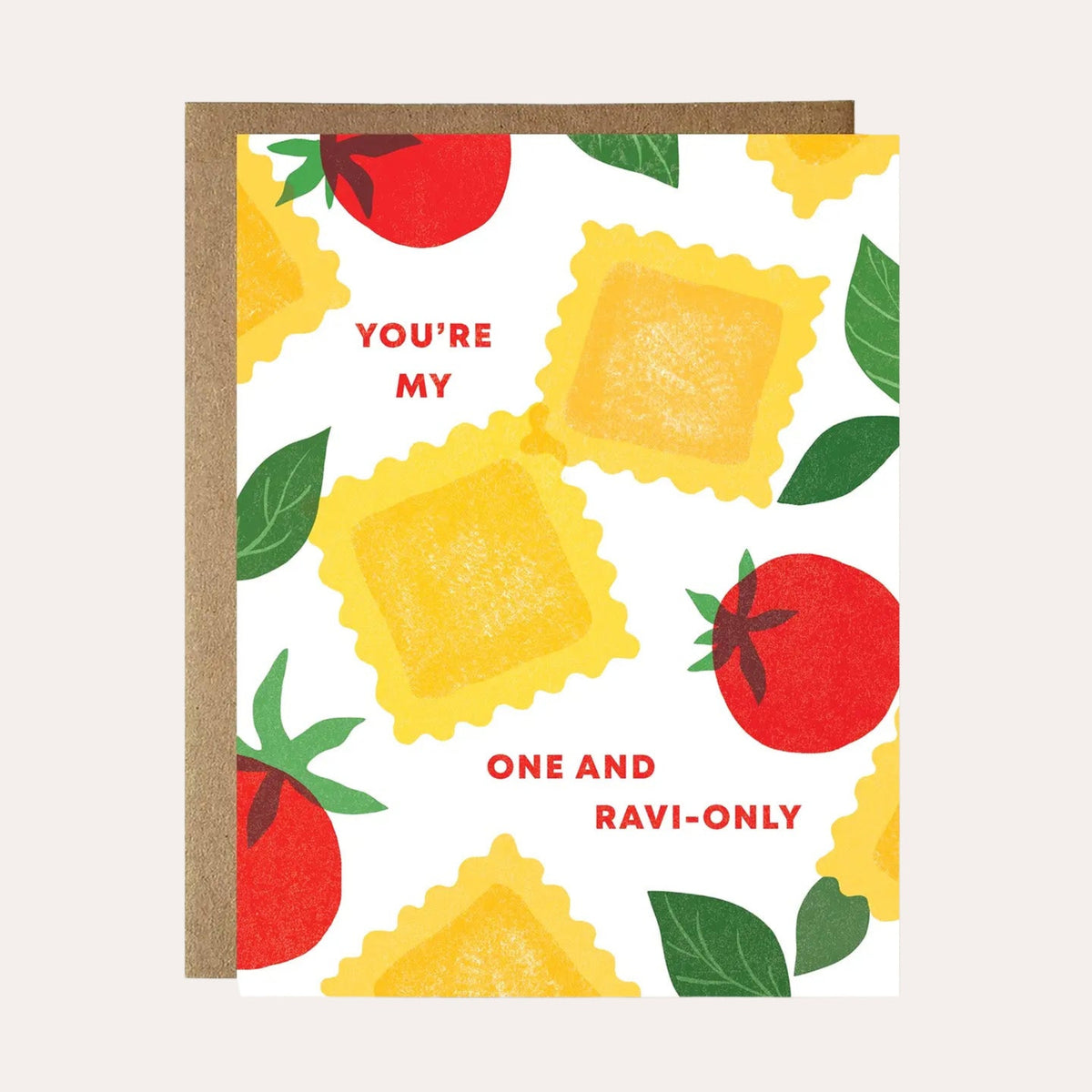 A square greeting card with a kraft paper envelope, featuring a playful Italian-themed pattern of yellow ravioli, red tomatoes, and green basil leaves on a white background. The text on the card reads 'YOU'RE MY ONE AND RAVI-ONLY'.