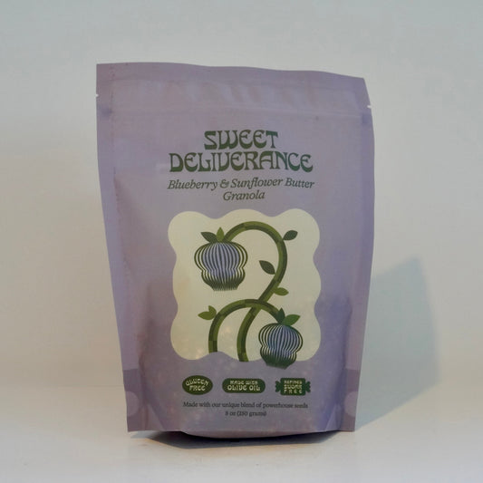 Purple package of 'Sweet Deliverance' granola with a white label on a white background