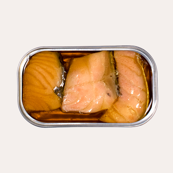 Canned salmon in a metal can on a white background