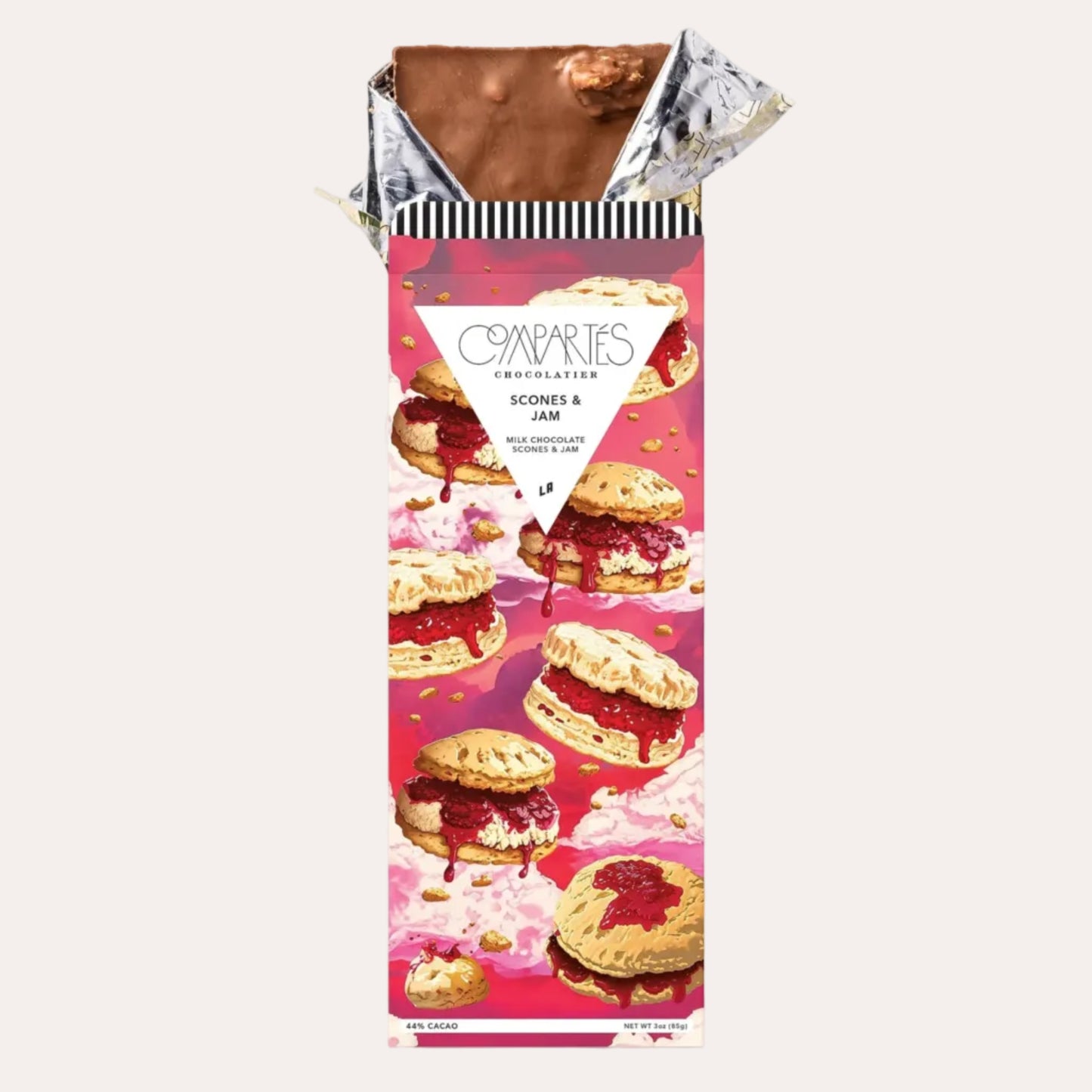 Chocolate bar packaging with a pink and white design featuring cookies and jam.