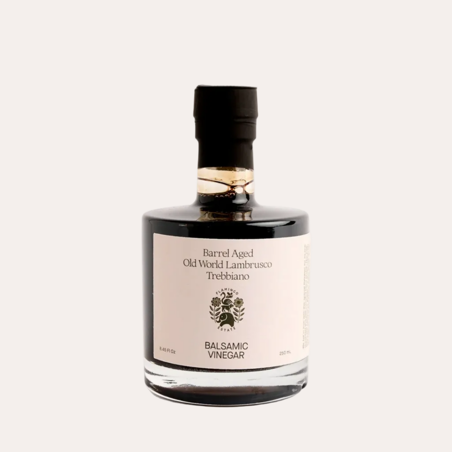 Bottle of Barrel Aged Old World Lambrusco Trebbiano Balsamic Vinegar on a light gray background