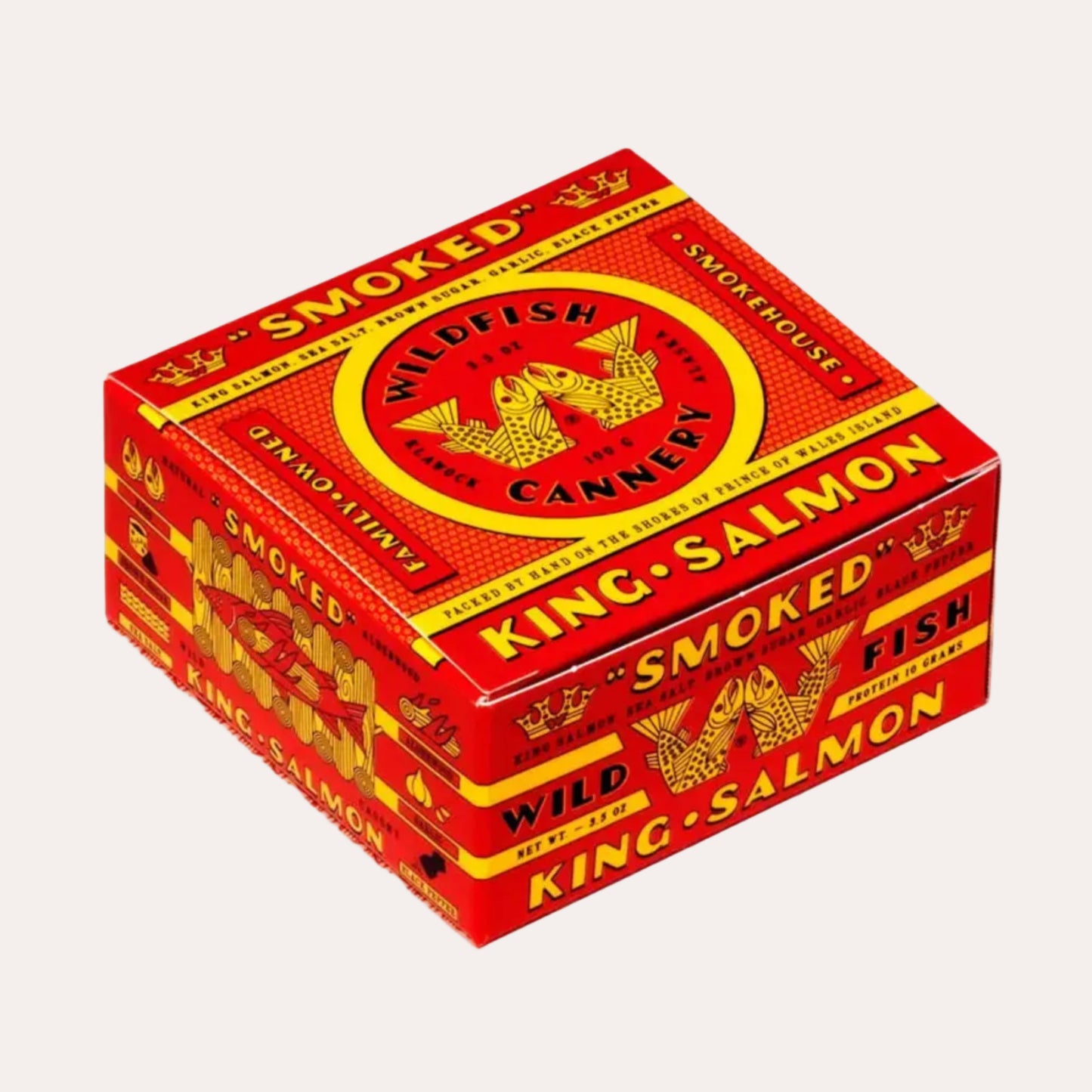 Red and yellow packaging of smoked salmon from Wildfish Cannery on a white background