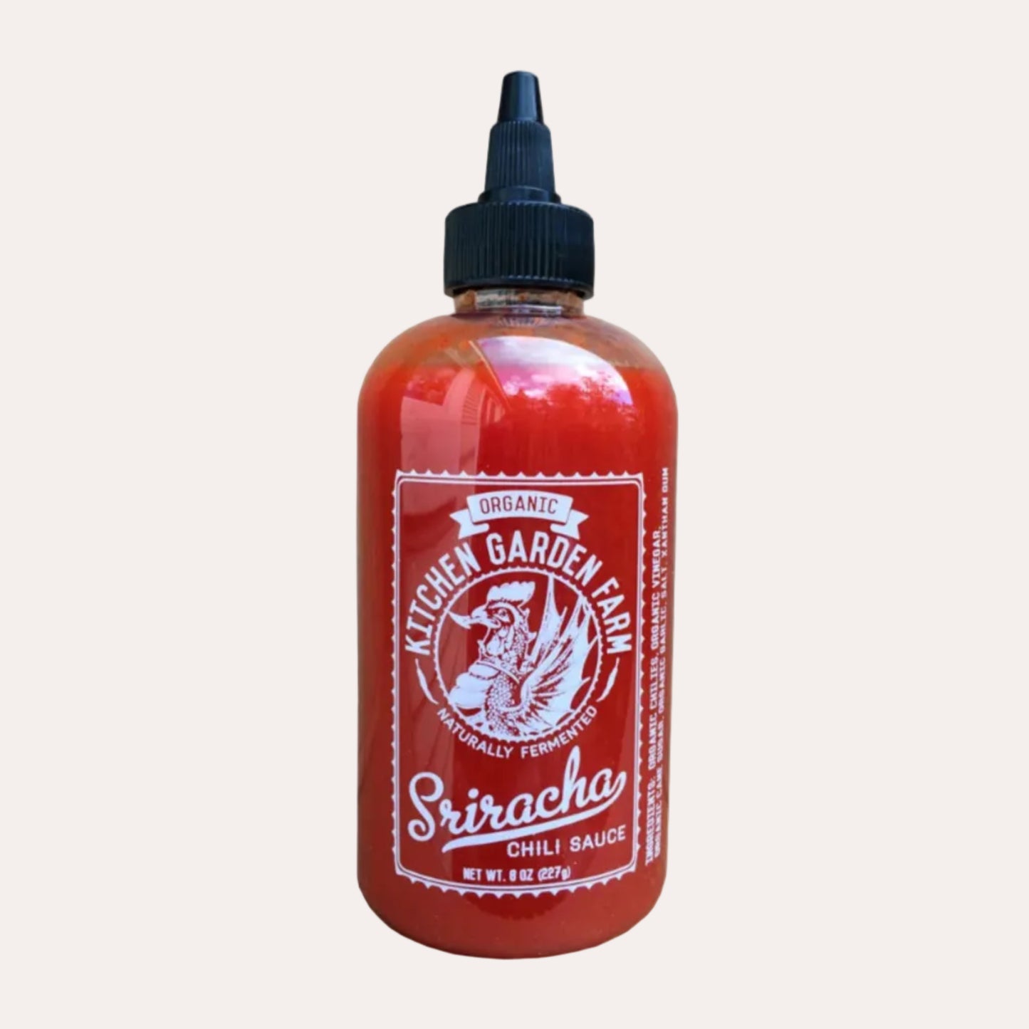 Bottle of Kitchen Garden Farm Sriracha Chili Sauce on a white background
Cork Market & The Candy Castle