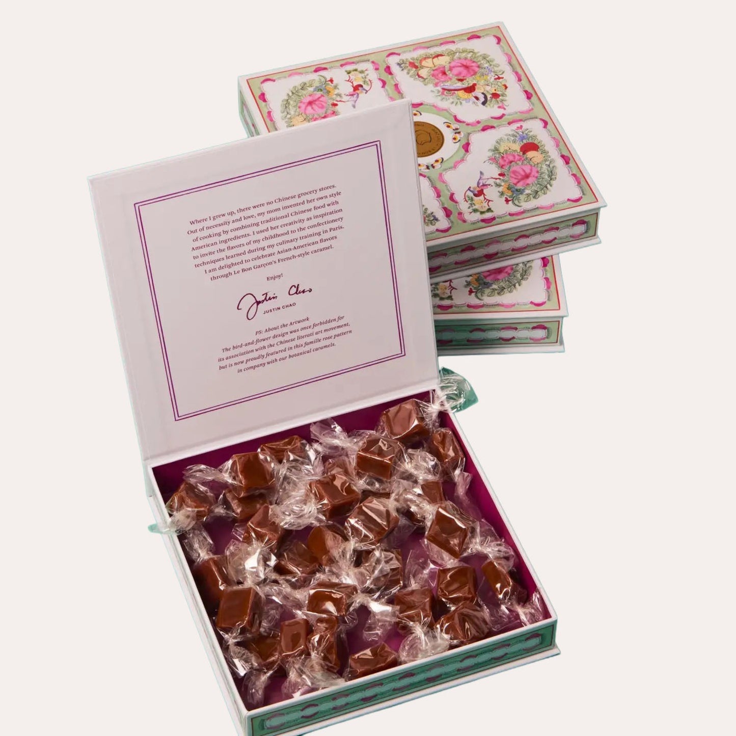 Box of chocolates with a decorative lid on a white background