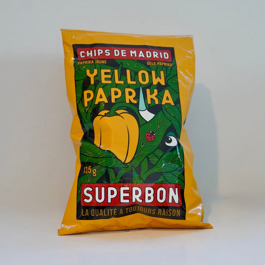 Yellow paprika packaging with green leaf design on a white background