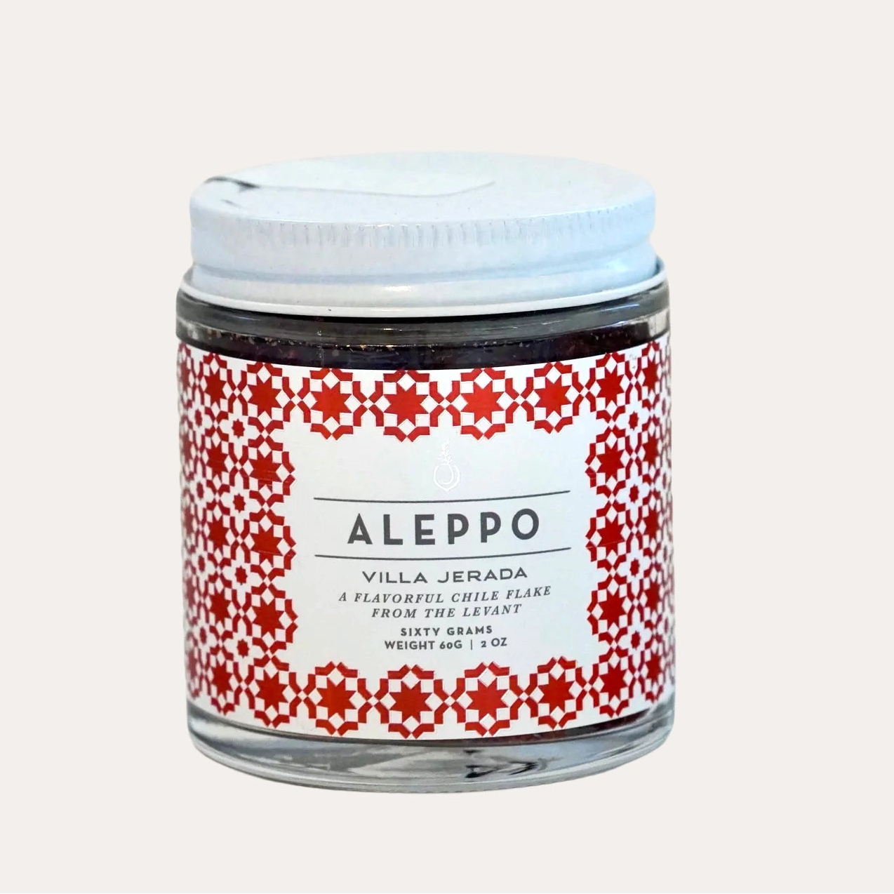 Jar of Aleppo product with red and white label on a light gray background
