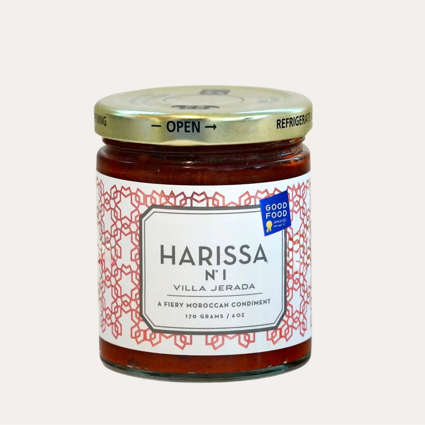 Jar of Harissa with a visible label on a white background