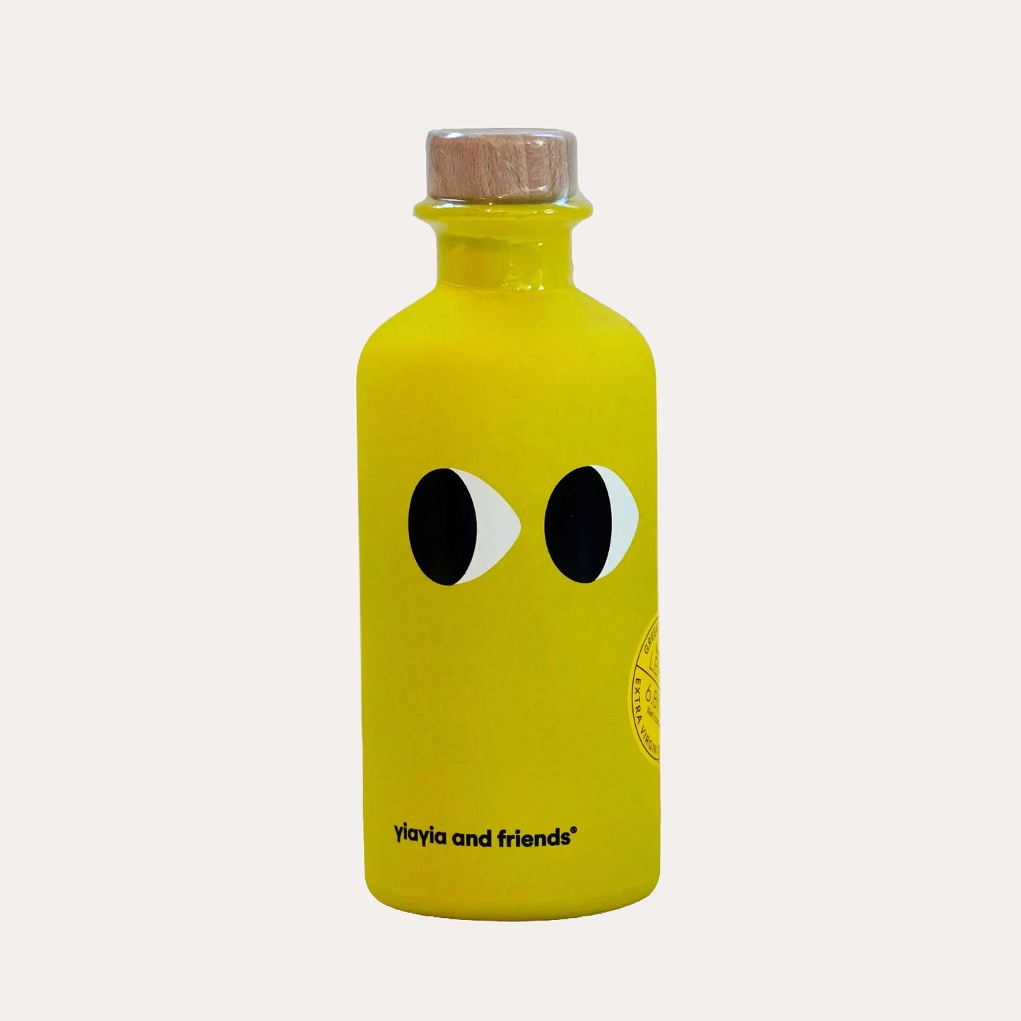 Yellow bottle with black eye design on a white background