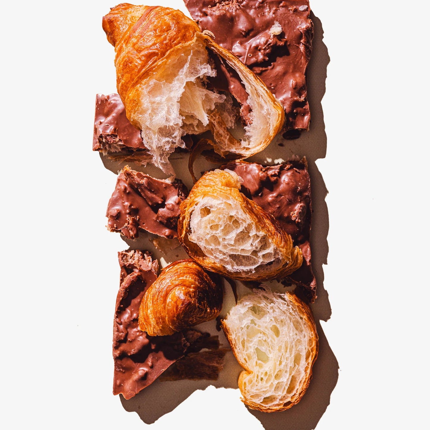 Chocolate croissant bars with croissants on a white background